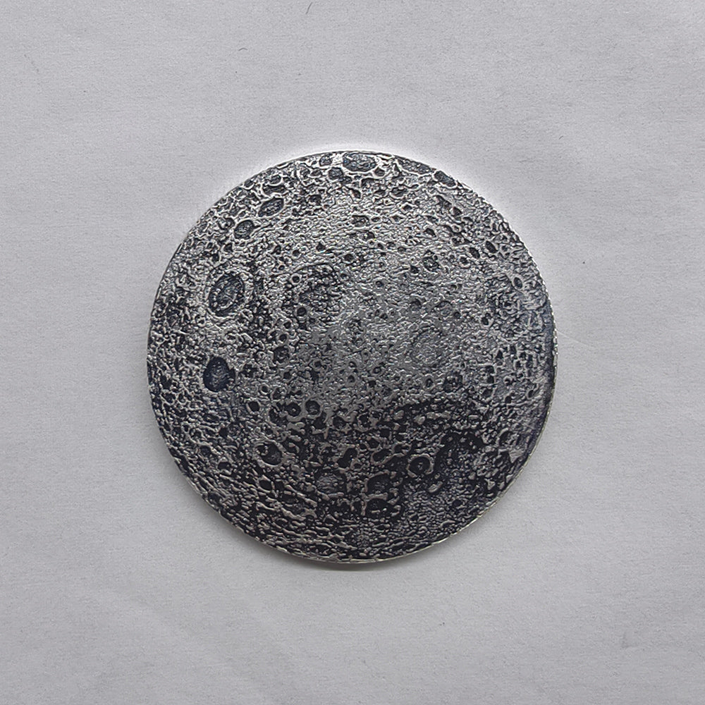 moon coin, lunar surface coin, moon texture coin, space collectible coin, decorative metal coin, round souvenir coin, collectible badge coin, lunar collectible, novelty moon coin, astronomy coin souvenir, metal collectible coin, space themed coin, collectible souvenir coin, moon design coin, unique collectible coin